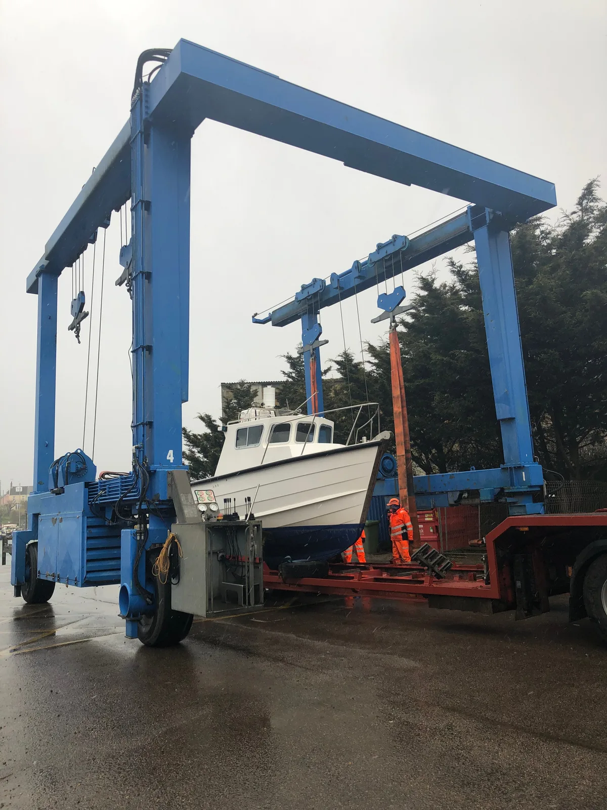 The workboat Morning Flight in a boatyard hoist